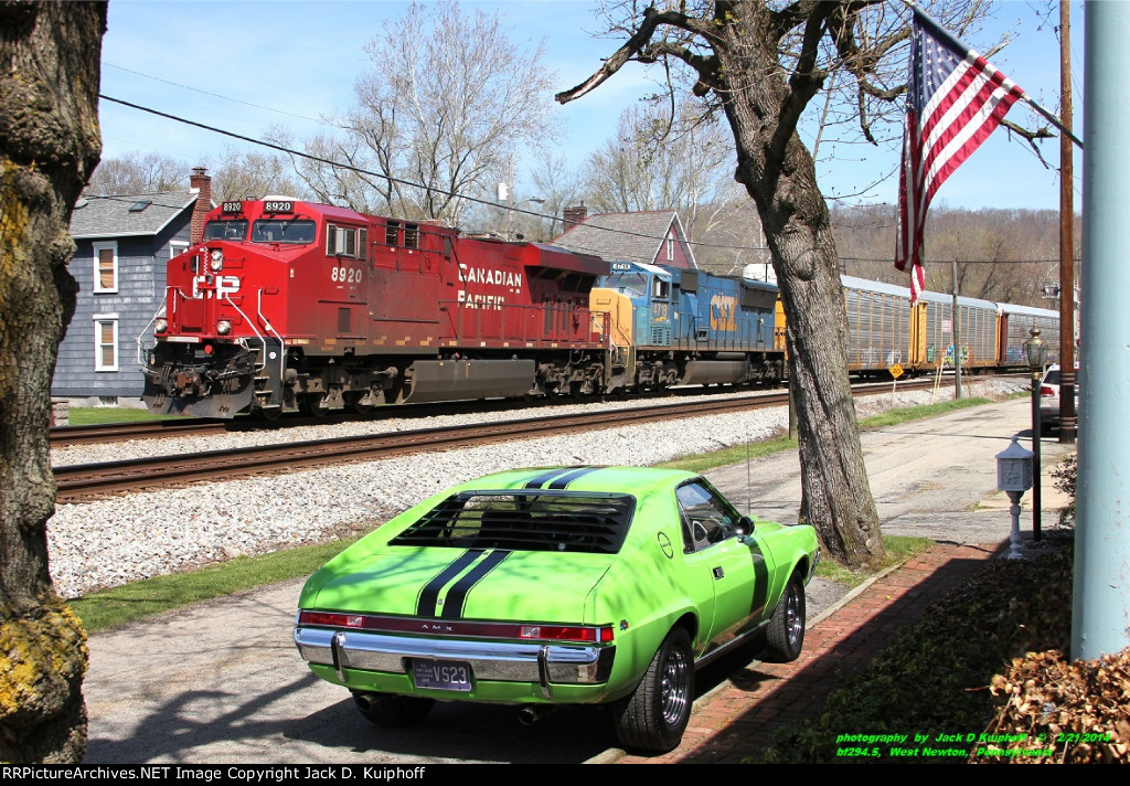 Canadian Pacific ES44AC 8920 leading CSX SD70MAC 4718 on the ex-B&O Chicago main line, now CSXs Pittsburgh Subdivision, at BF-294.5 in West Newton, Pennsylvania on April 21, 2014. 